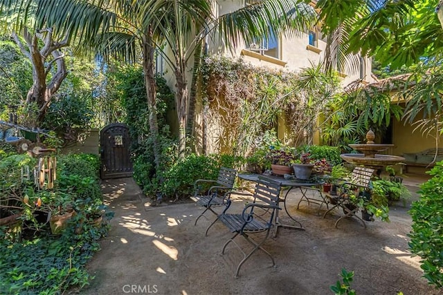view of patio with a gate