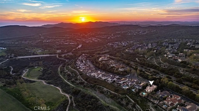 birds eye view of property featuring a mountain view
