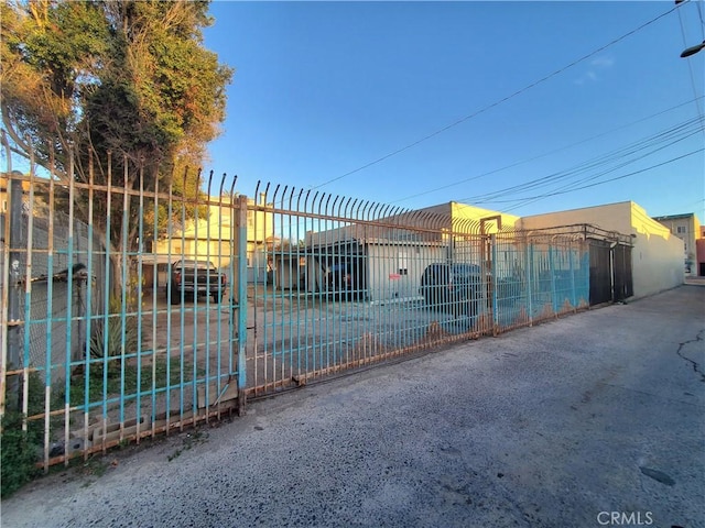 view of gate with fence