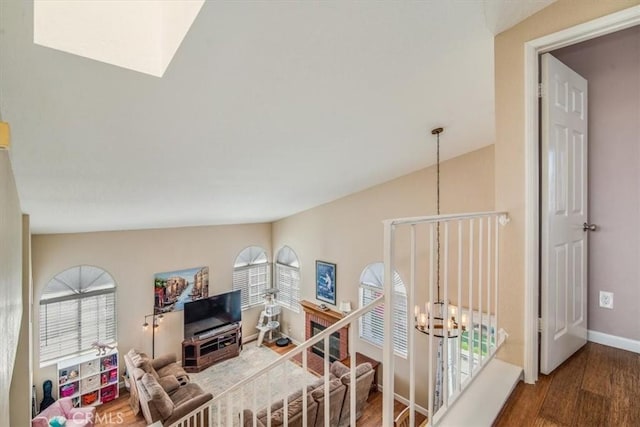 interior space featuring a chandelier, wood finished floors, and a wealth of natural light