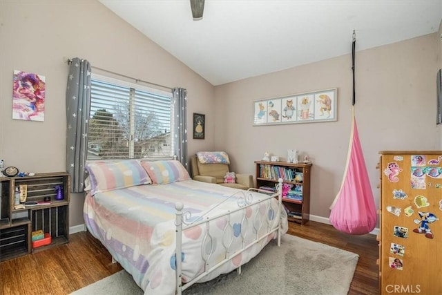 bedroom featuring lofted ceiling, ceiling fan, baseboards, and wood finished floors