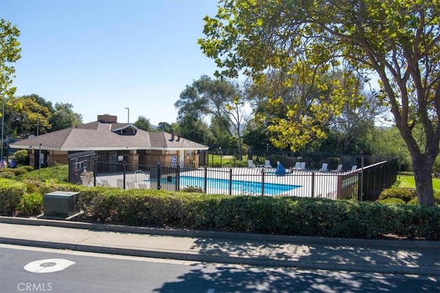 pool featuring a patio area and fence