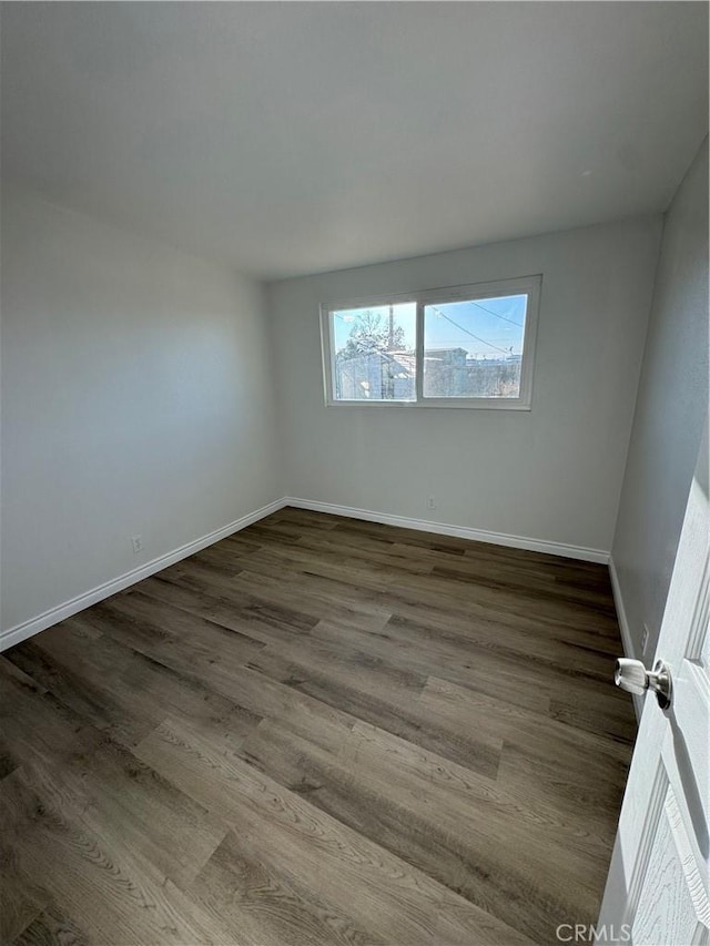 13063 Gilbert St, Edwards, CA 93523 - unfurnished room with dark wood finished floors