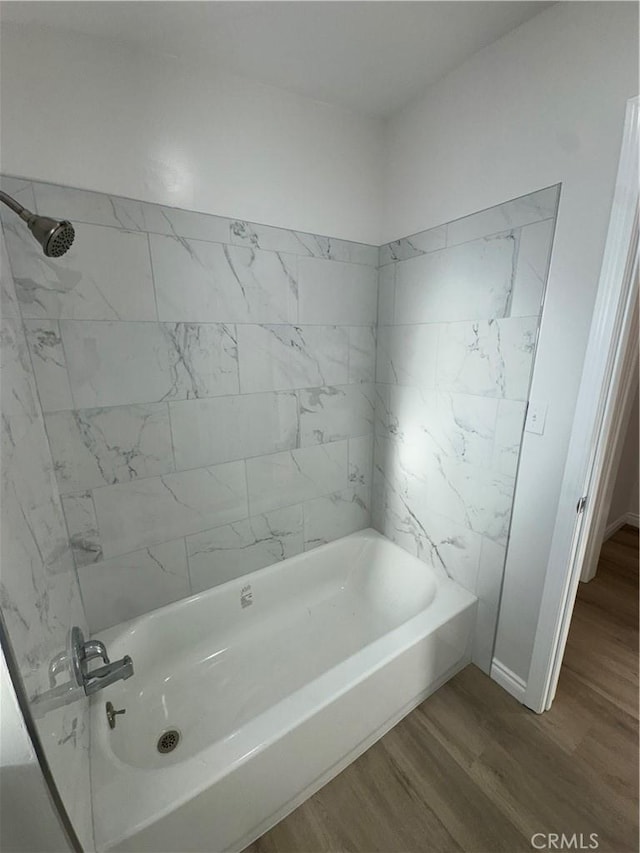 full bath with shower / tub combination and wood finished floors