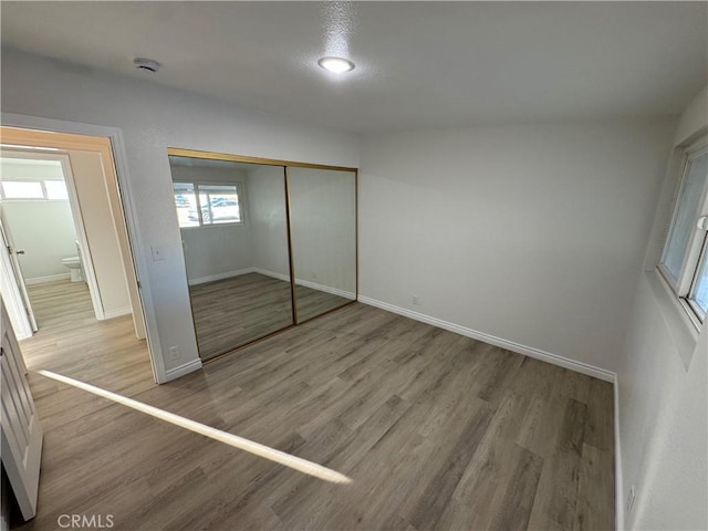 13063 Gilbert St, Edwards, CA 93523 - unfurnished bedroom featuring wood finished floors and a closet