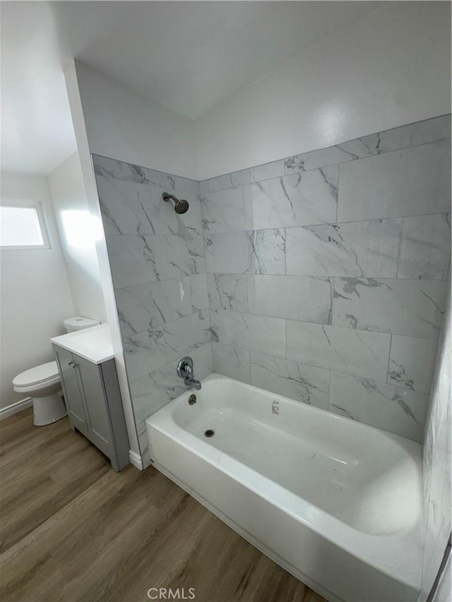 13063 Gilbert St, Edwards, CA 93523 - full bathroom with wood finished floors, shower / bathtub combination, and vanity