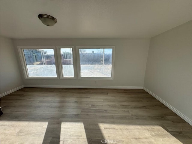 13063 Gilbert St, Edwards, CA 93523 - spare room with plenty of natural light and wood finished floors