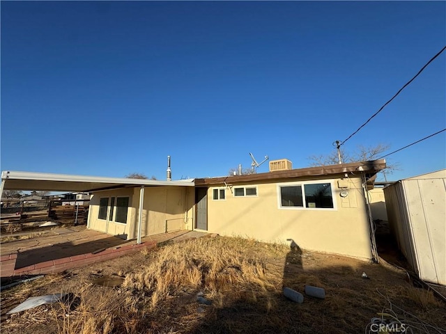 13063 Gilbert St, Edwards, CA 93523 - back of house featuring stucco siding