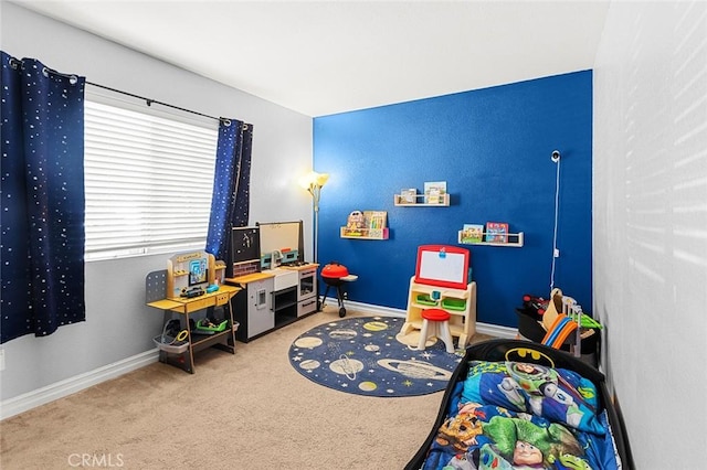 playroom featuring carpet flooring and baseboards