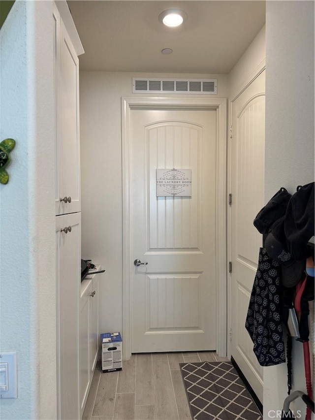 doorway with visible vents and wood tiled floor