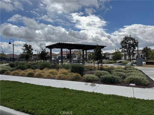 view of home's community with a residential view and a yard