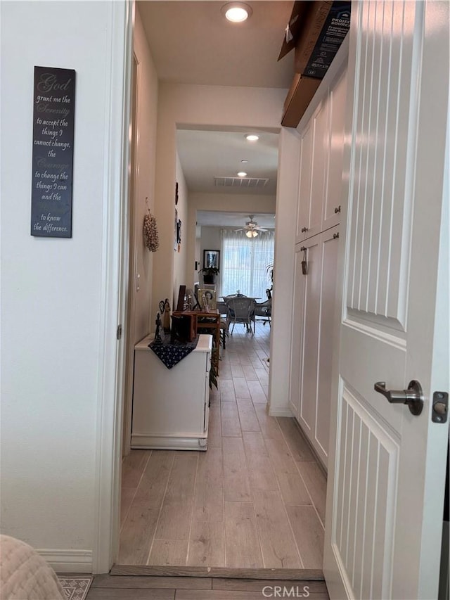 corridor featuring recessed lighting, visible vents, and light wood-style flooring