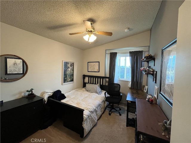 bedroom with vaulted ceiling, carpet flooring, a ceiling fan, and a textured ceiling