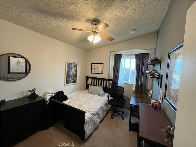 carpeted bedroom featuring ceiling fan, vaulted ceiling, and a textured ceiling