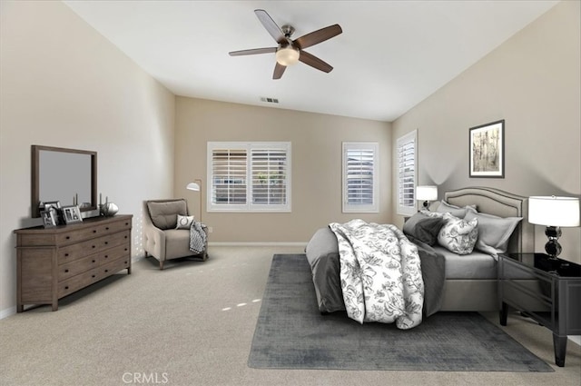 bedroom featuring baseboards, visible vents, vaulted ceiling, and carpet flooring