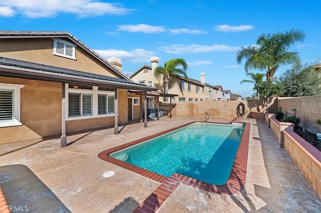 view of pool with a fenced in pool, a fenced backyard, and a patio