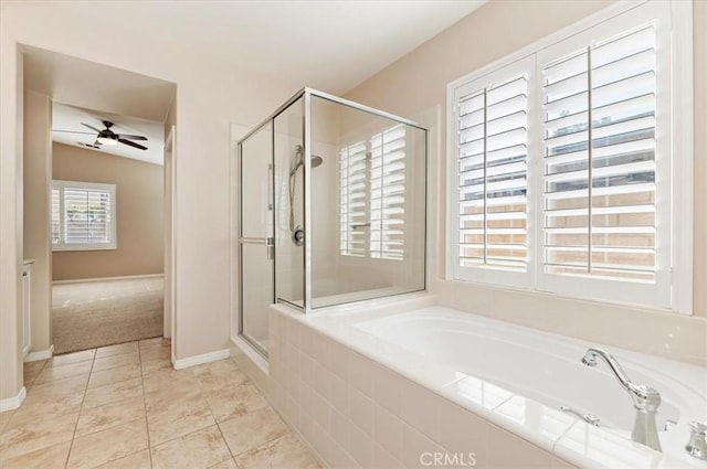 full bath featuring a garden tub, a ceiling fan, a stall shower, baseboards, and tile patterned floors