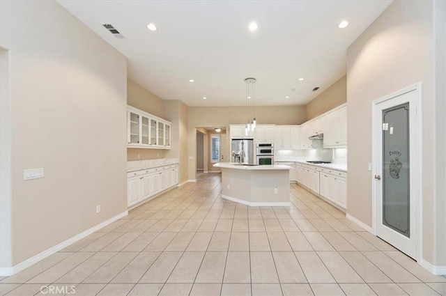 kitchen with recessed lighting, light countertops, visible vents, appliances with stainless steel finishes, and white cabinetry