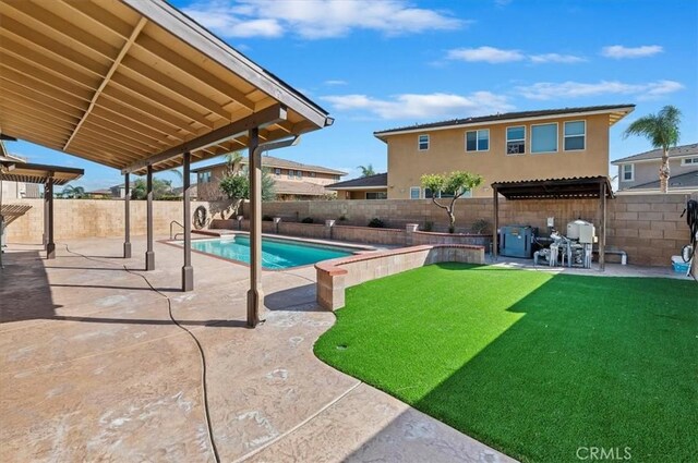 view of swimming pool featuring a fenced in pool, a yard, a fenced backyard, and a patio