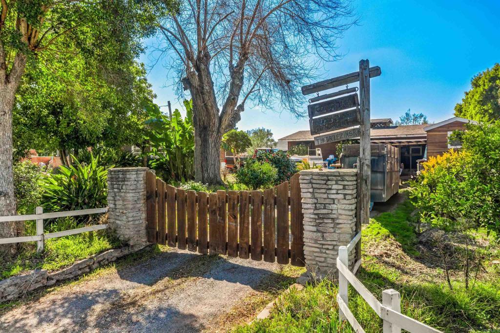 view of gate with fence