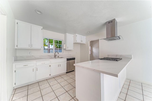 kitchen featuring a peninsula, a sink, white cabinetry, ventilation hood, and stainless steel dishwasher