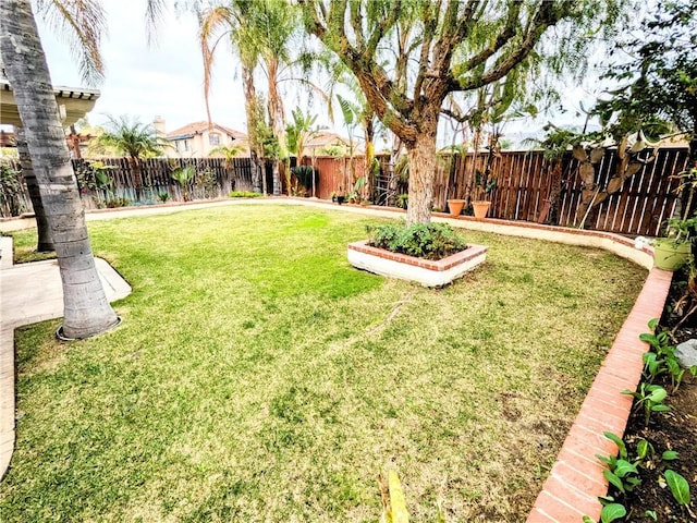 view of yard featuring a fenced backyard