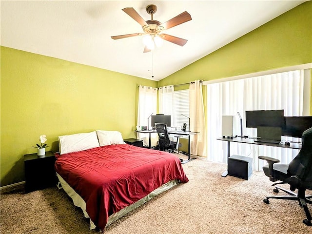 carpeted bedroom featuring vaulted ceiling and a ceiling fan