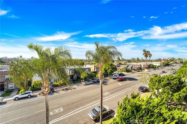 view of road with sidewalks and a residential view