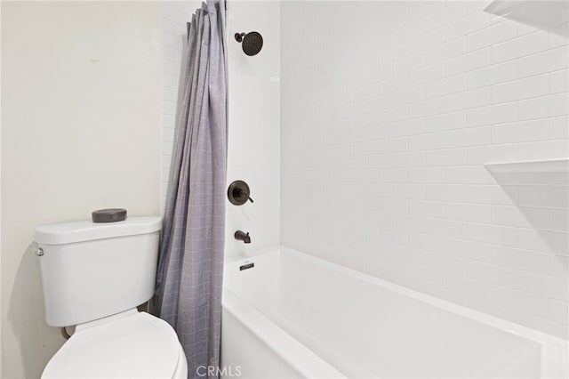 full bath with toilet and shower / bath combo with shower curtain