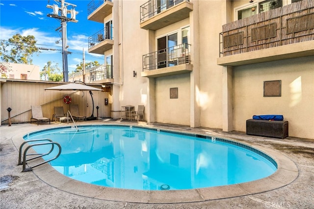 view of pool featuring a fenced in pool and a patio