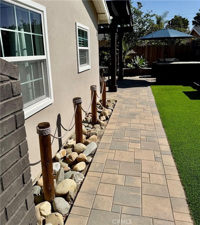 view of patio / terrace featuring fence