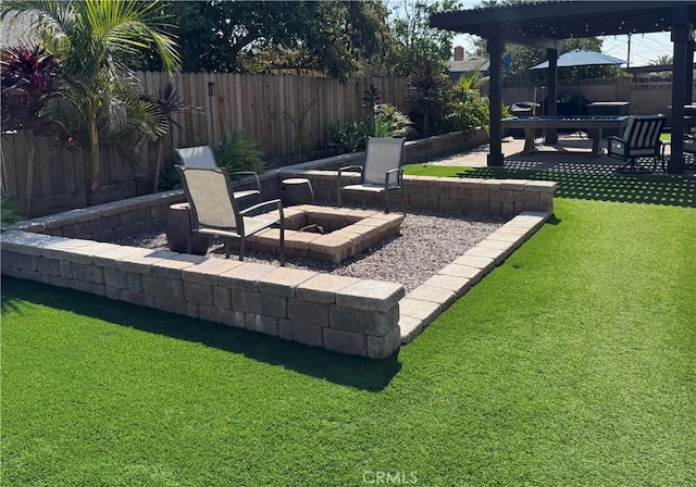 exterior space featuring a patio, a fire pit, and a fenced backyard