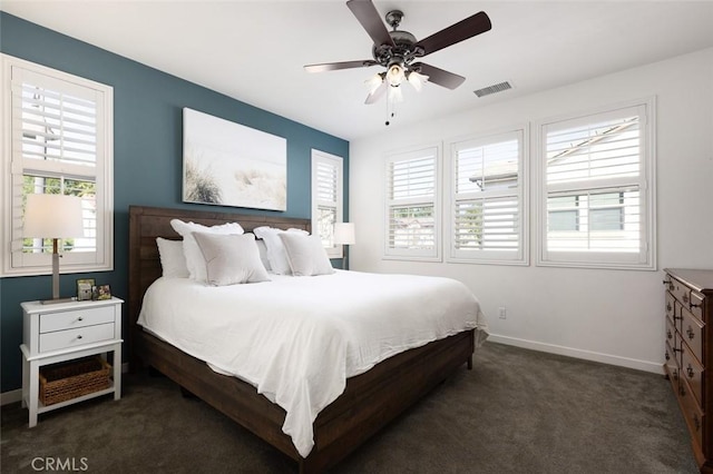 bedroom with visible vents, baseboards, a ceiling fan, and carpet flooring