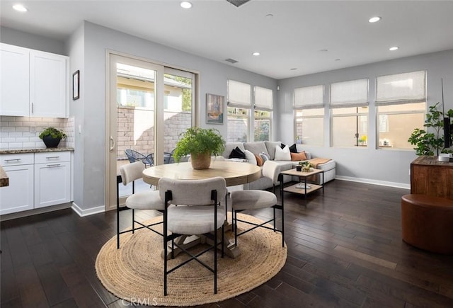 dining space with recessed lighting, dark wood-style floors, visible vents, and baseboards