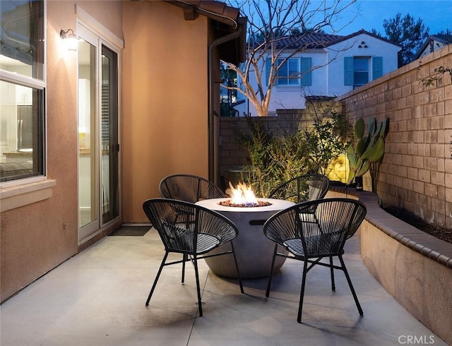 view of patio / terrace with a fenced backyard and an outdoor fire pit