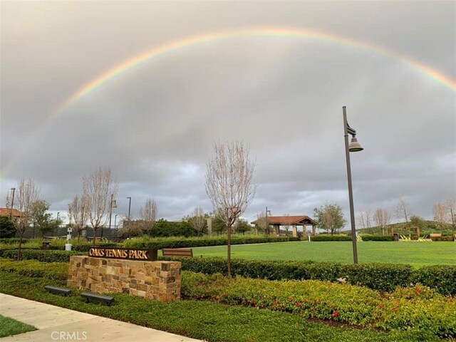 view of home's community with a lawn