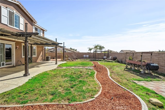 view of yard with a fenced backyard, central AC, a pergola, and a patio