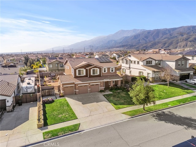 exterior space with a mountain view and a residential view