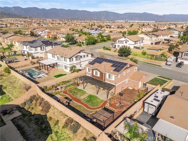 drone / aerial view with a residential view and a mountain view