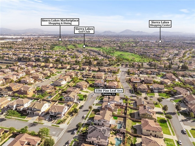 exterior space with a mountain view and a residential view