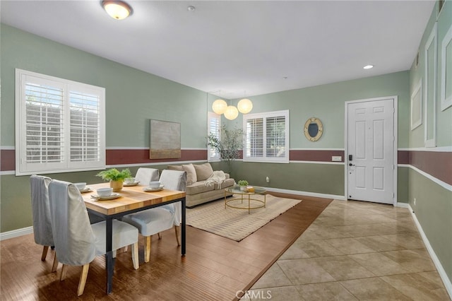 living area featuring tile patterned floors and baseboards