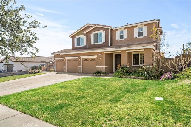 traditional-style house featuring concrete driveway, an attached garage, fence, a front lawn, and stucco siding