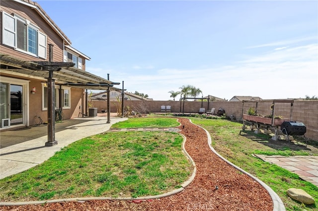 view of yard featuring central AC unit, a patio area, a fenced backyard, and a pergola