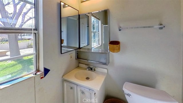 bathroom with vanity and toilet