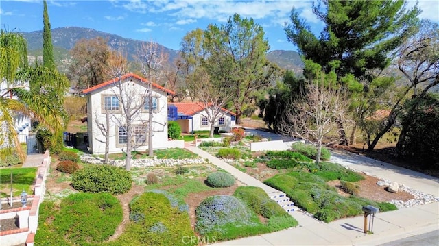 birds eye view of property featuring a mountain view