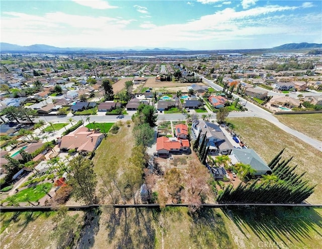 bird's eye view featuring a residential view and a mountain view