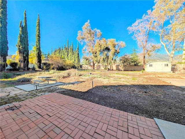 view of yard featuring a patio area and fence