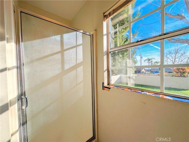 full bath featuring a shower stall