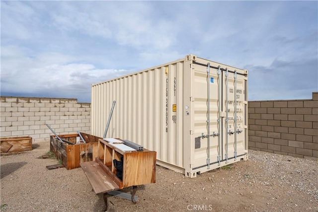 view of outbuilding featuring a fenced backyard