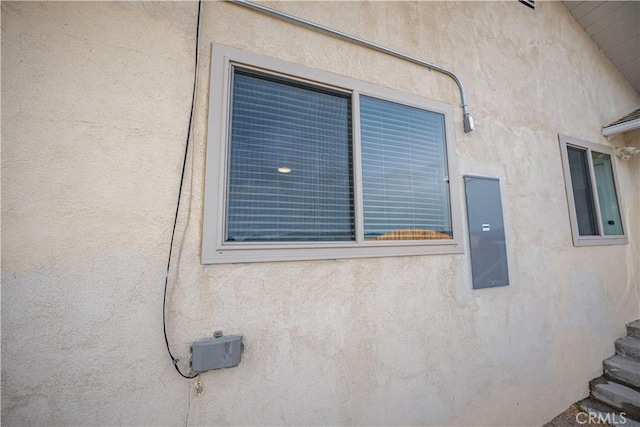 exterior details featuring stucco siding